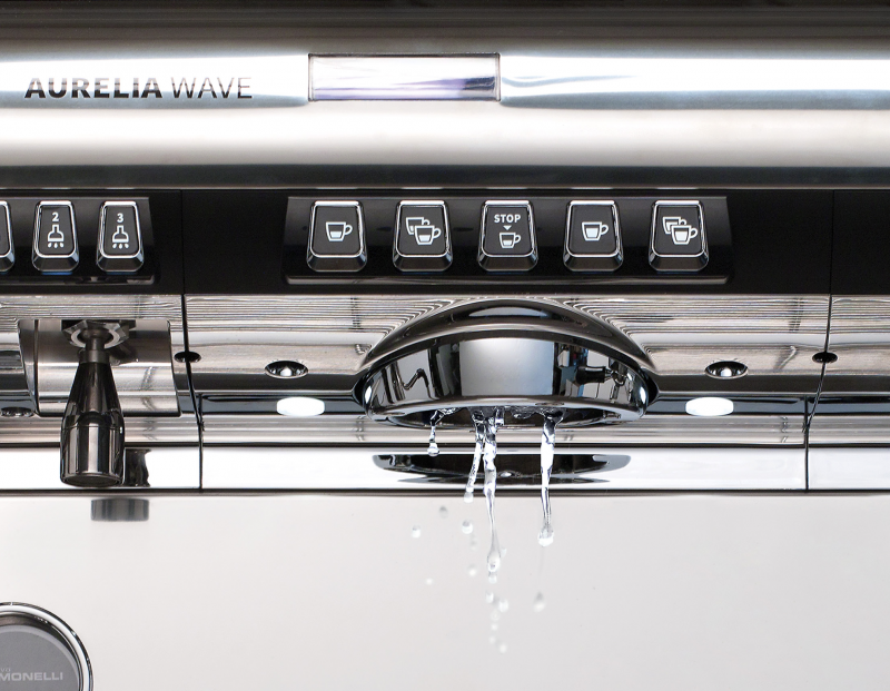 This is a closeup image of the brew group and hot water outlet on the Aurelia Wave T3